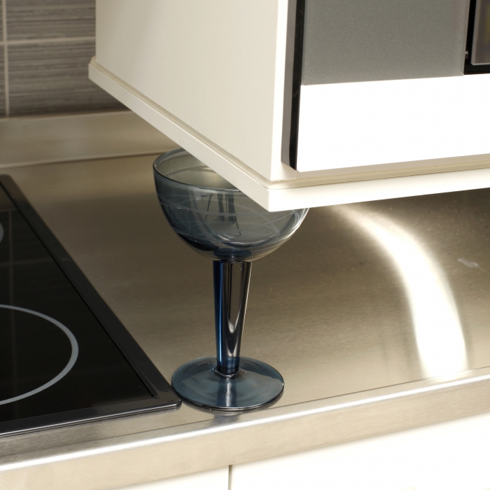 A safety plate is mounted under the cabinet. The plate stops the movement at the slightest resistance.